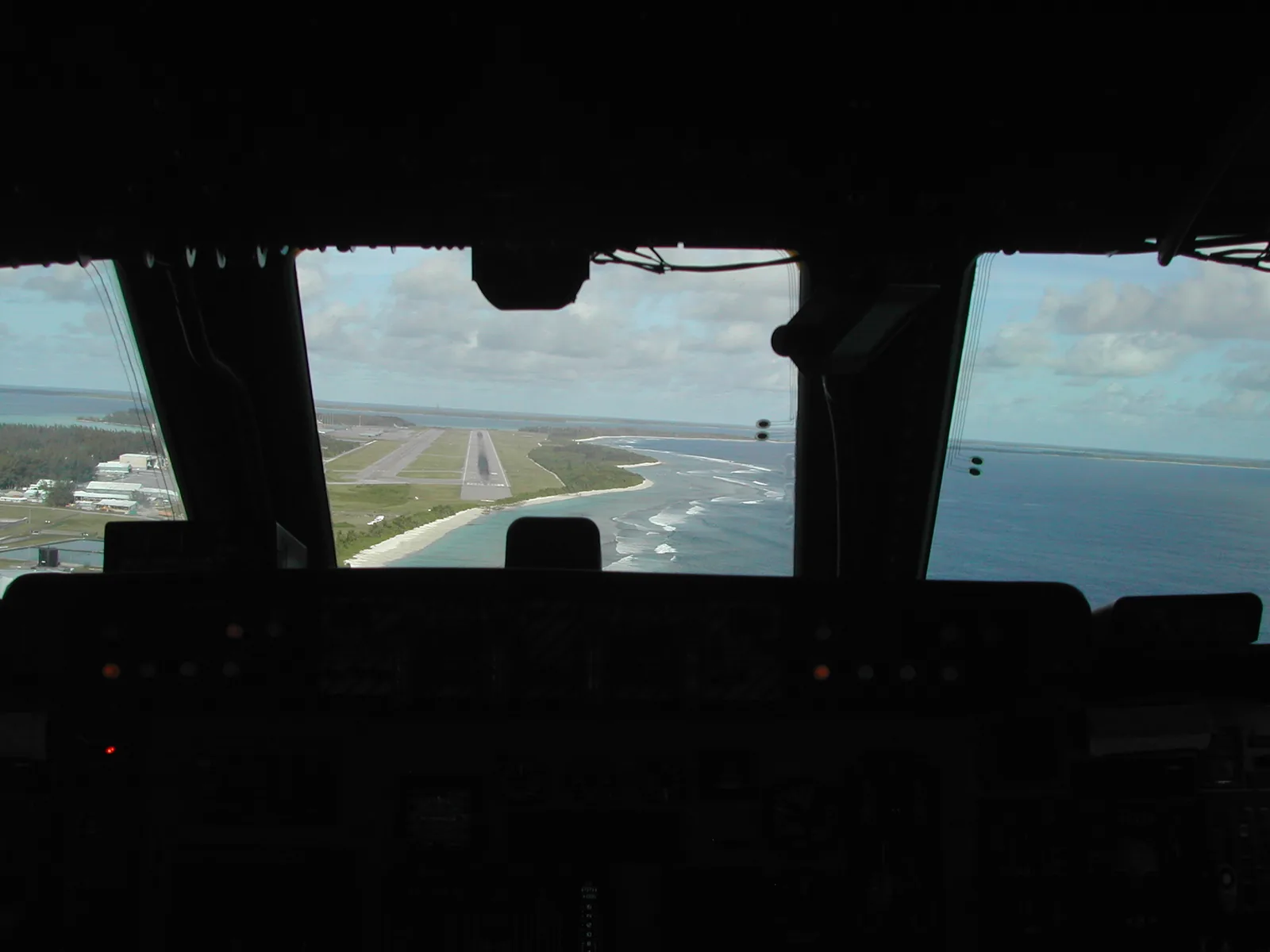 View from the C-5 Galaxy cockpit on approach — runway visible through the windscreen