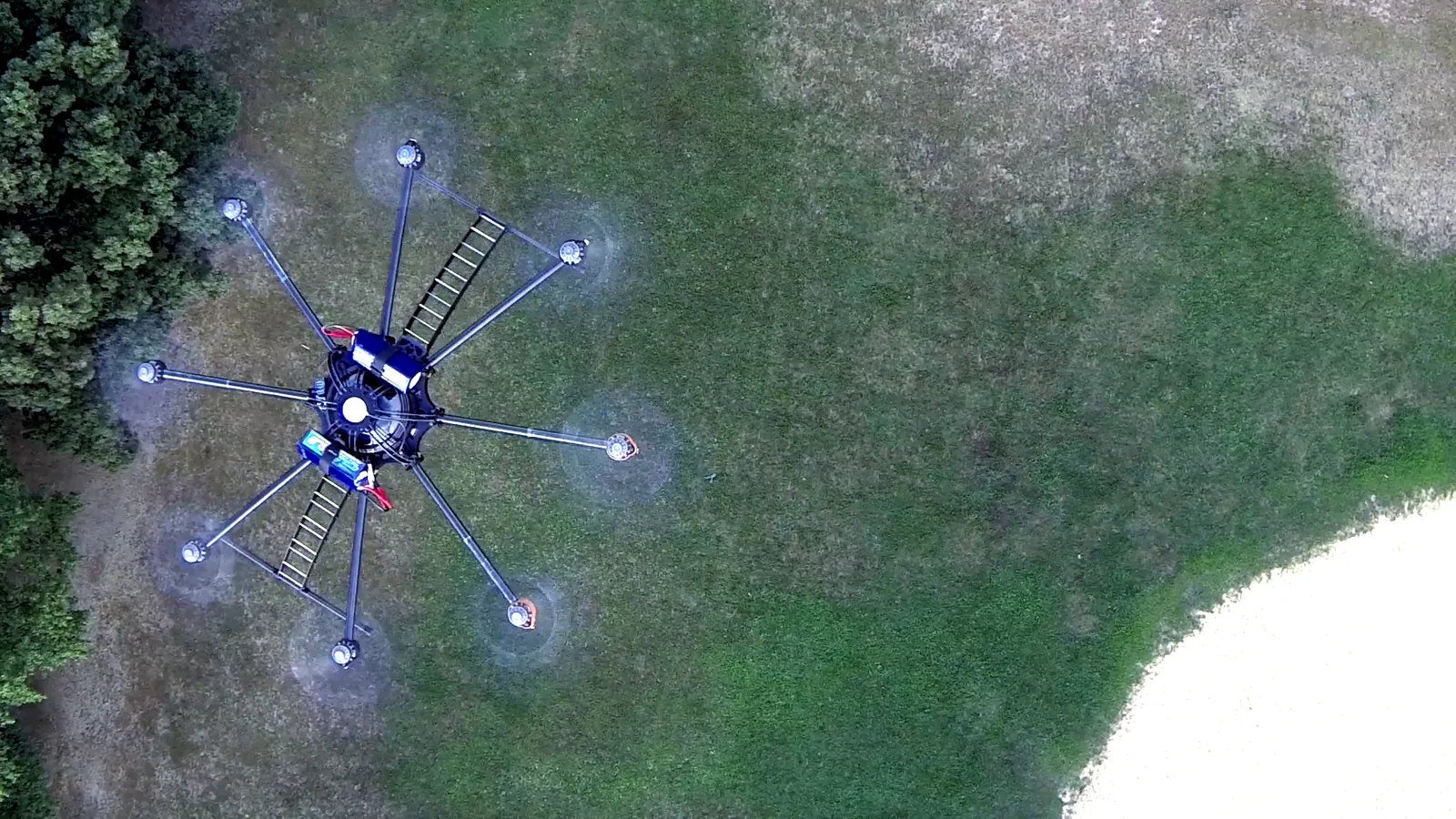 One of the studio's early custom-built octocopters photographed in flight from above