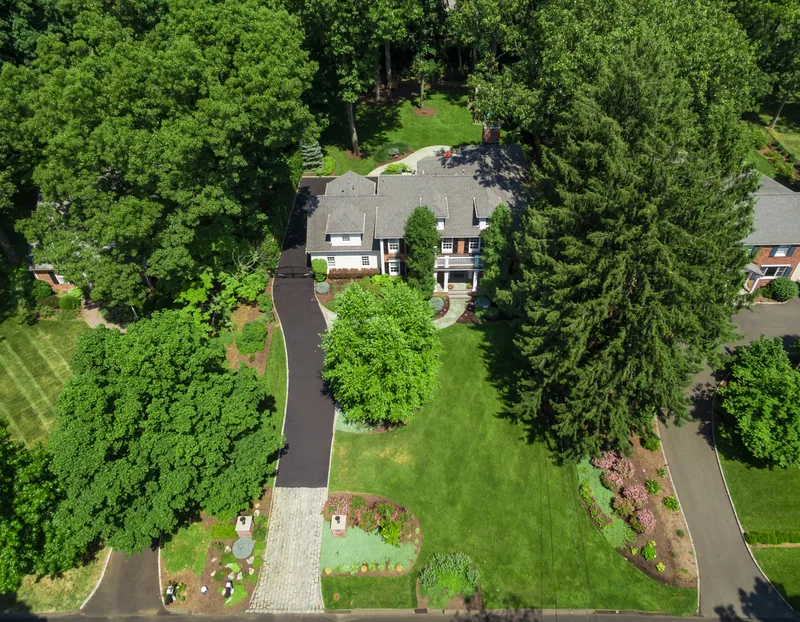 Overhead aerial of a Chatham, NJ home showing the lot, drive, and mature trees