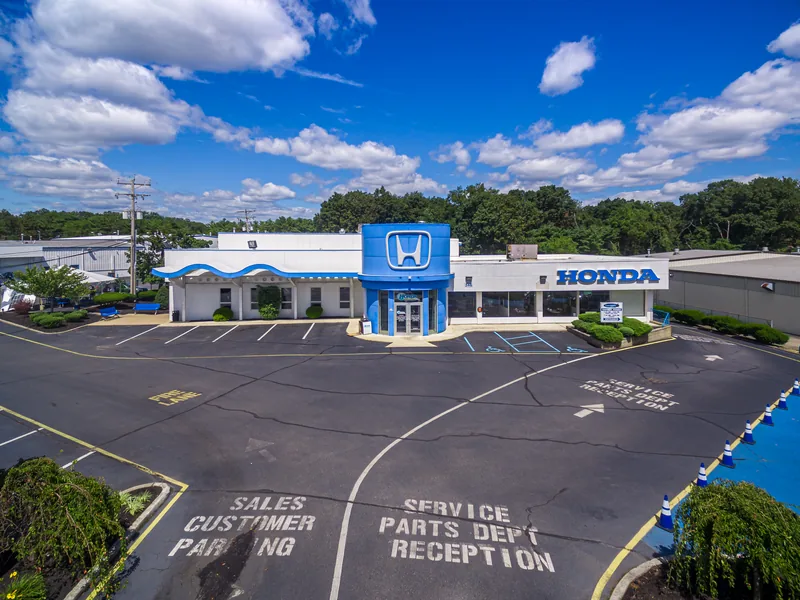 Aerial of the Honda dealership in Toms River, NJ — showroom, service entrance, and customer parking in one frame