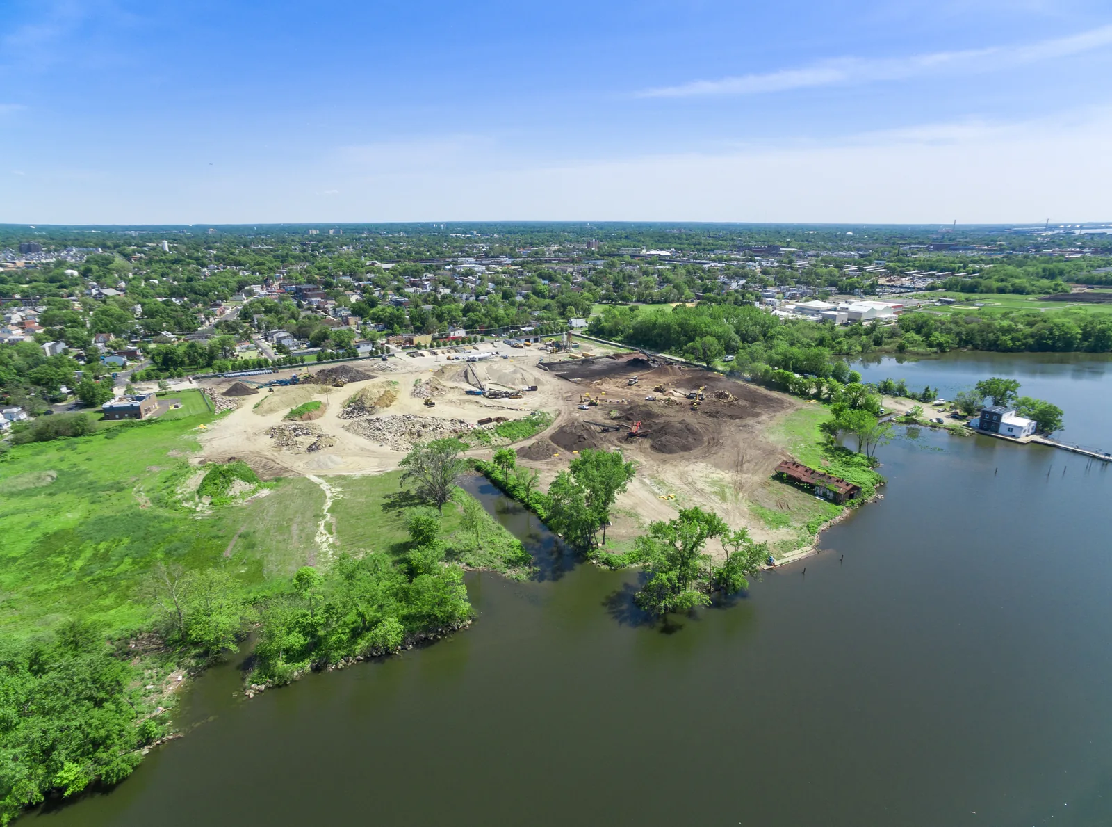 Riverfront parcel in Camden, NJ, with the river wrapping around it, photographed from the air
