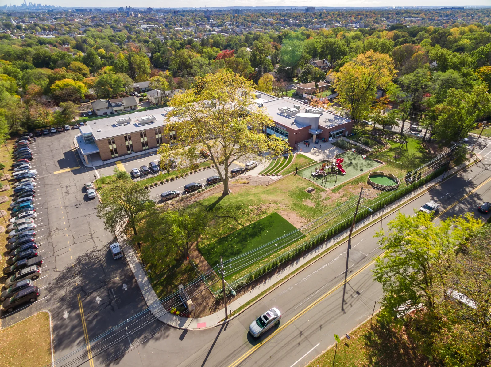 Overhead of a NJ school campus: building, playground, and grounds in plan view